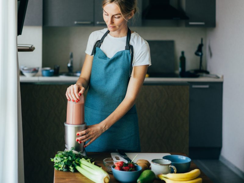 young-wellness-woman-preparing-a-nutritious-healthy-breakfast-in-her-kitchen-.jpg